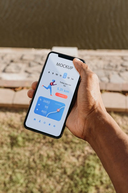Free Runner Holding A Mock-Up Smartphone Psd