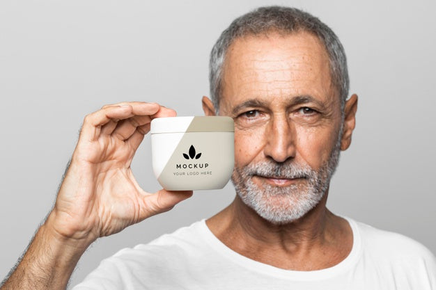 Free Senior Man Holding Cream Container Psd