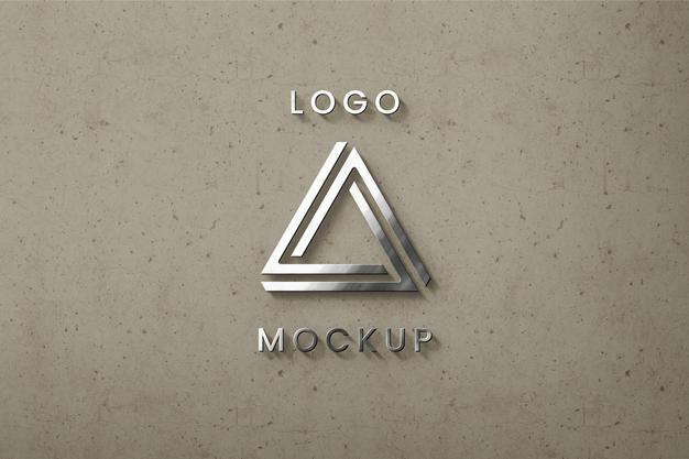 Free Sirlver Logo On Beige Wall Mockup Psd