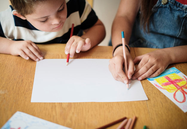 Free Sister And Brother Drawing At A Table Psd