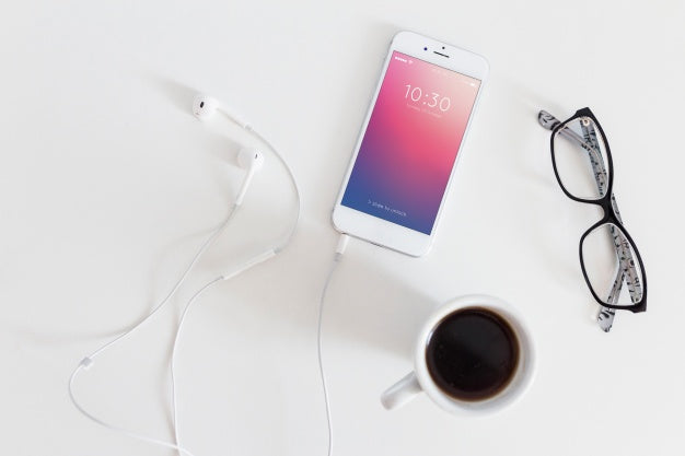 Free Smartphone Mockup With Charging Cable And Earphones Psd