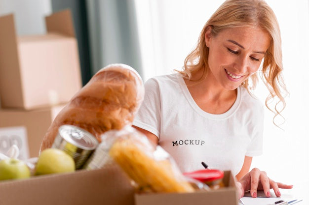 Free Smiley Female Volunteer Writing Down Food For Donation Boxes Psd