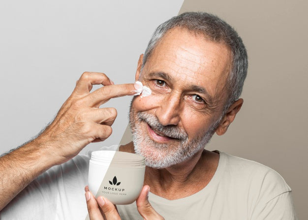 Free Smiley Senior Man Holding Cream Container Psd