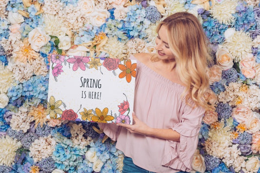 Free Spring Concept With Woman Holding Paper Mockup Psd