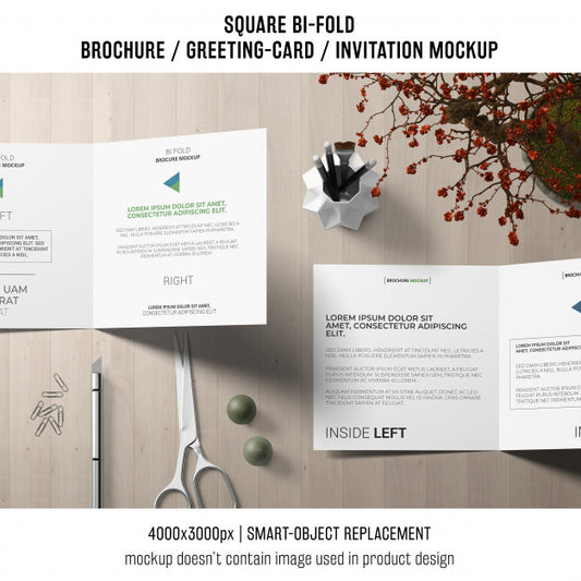 Free Square Bi-Fold Brochure Or Greeting Card Mockup On Creative Workspace Psd