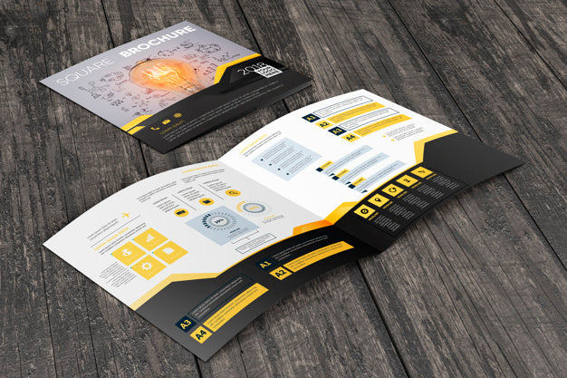 Free Square Brochure Mockup On Wooden Surface Psd