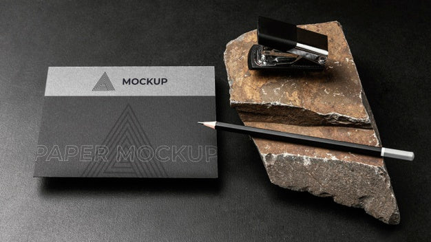 Free Stationery Mock-Up On Dark Concrete With Rugged Rock Psd