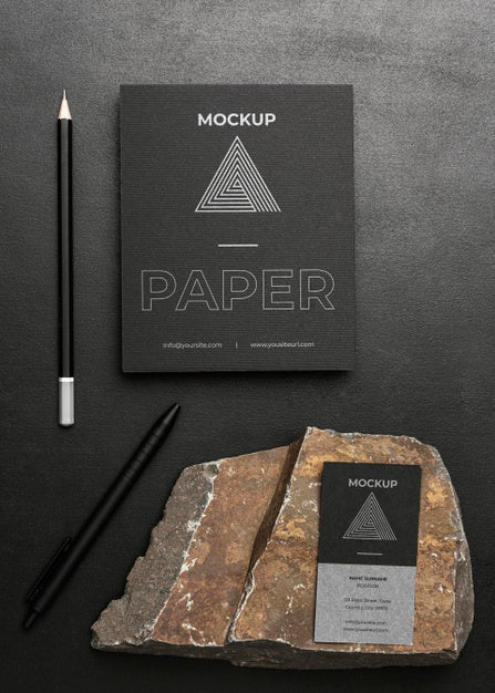 Free Stationery Mock-Up On Dark Concrete With Rugged Rock Psd