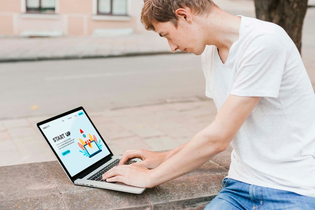 Free Student Working On Laptop Outdoors Psd