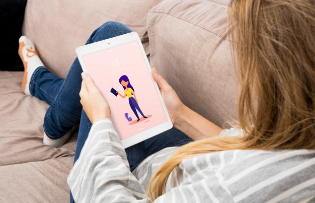 Free Tablet Mockup With Woman Chilling On Couch Psd