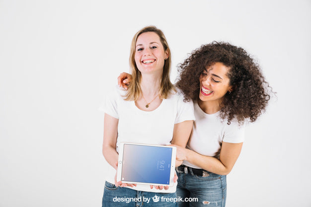 Free Technology Mockup With Happy Women Showing Tablet Psd