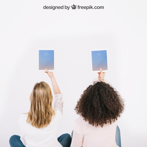 Free Technology Mockup With Women Holding Tables In Air Psd