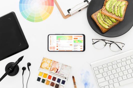 Free Top View Desk With Avocado Toast And Phone Mock-Up Psd