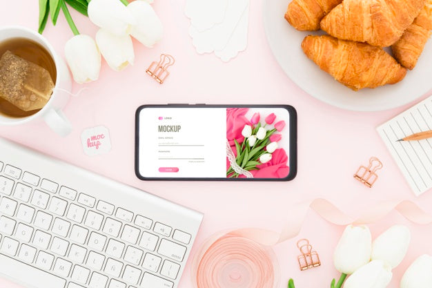 Free Top View Desk With Croissants And Phone Mock-Up Psd