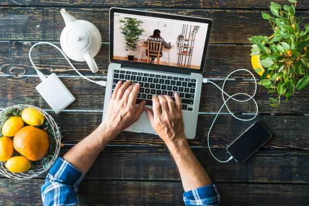 Free Top View Laptop Mockup With Fruits Psd