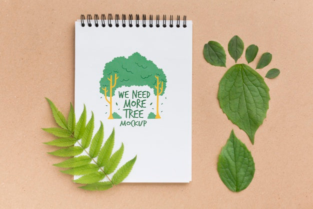 Free Top View Notebook Mock-Up With Leaves Psd