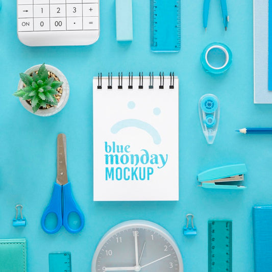 Free Top View Of Blue Monday Notebook With Stationery And Plant Psd