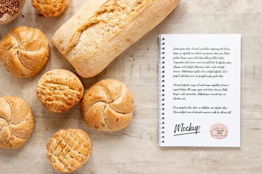 Free Top View Of Bread With Notebook Psd
