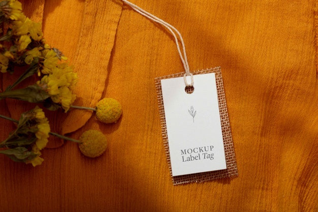 Free Top View Of Clothing Label On Orange Textile Psd