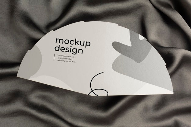 Free Top View Of Mock-Up Hand Fan On Black Textile Psd