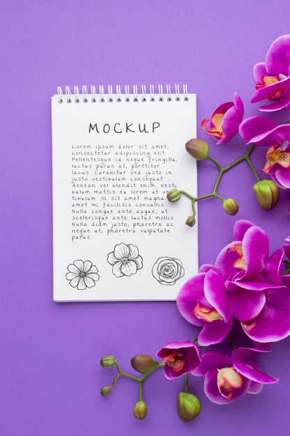 Free Top View Of Notebook Mock-Up With Orchid Psd