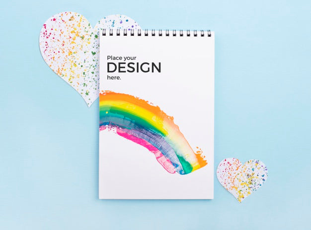 Free Top View Of Notebook With Rainbow And Heart Psd