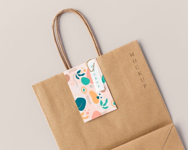 Free Top View Of Paper Shopping Bag Mock-Up With Paper Tag Psd