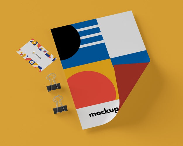 Free Top View Of Paper With Multicolored Shapes And Paper Clips Psd