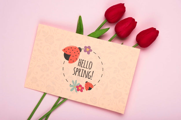 Free Top View Of Red Tulips And Card Psd