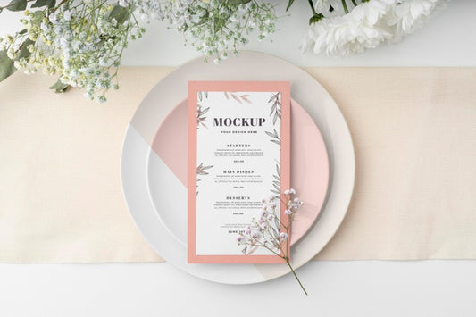 Free Top View Of Table Arrangement With Spring Menu Mock-Up And Flowers Psd