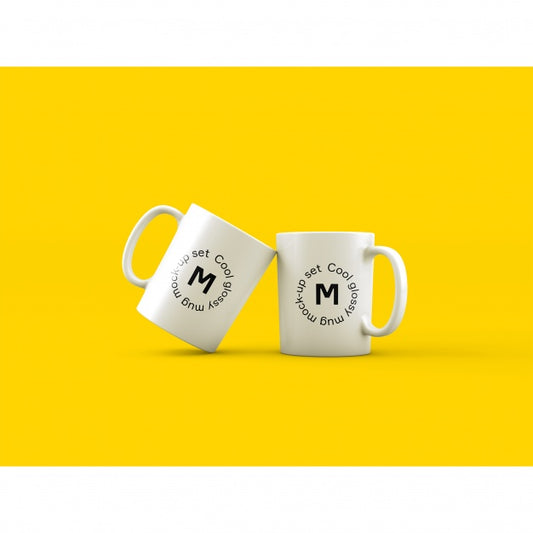 Free Two White Coffee Mugs on Yellow Background PSD Mockup