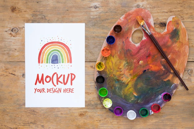 Free Watercolors And Brush On Desk Psd