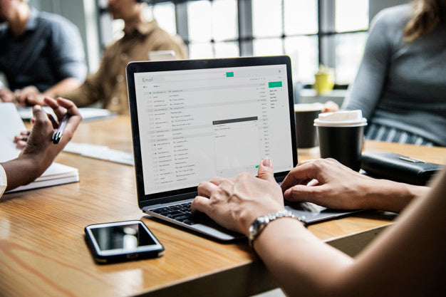 Free Woman Checking Her Email In A Meeting Psd