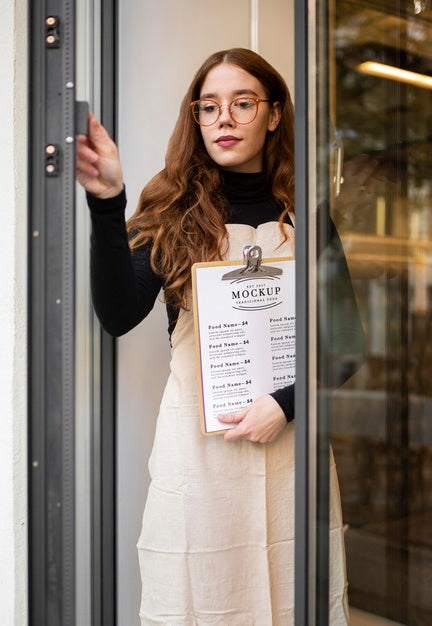 Free Woman Holding A Restaurant Menu Mock-Up Psd