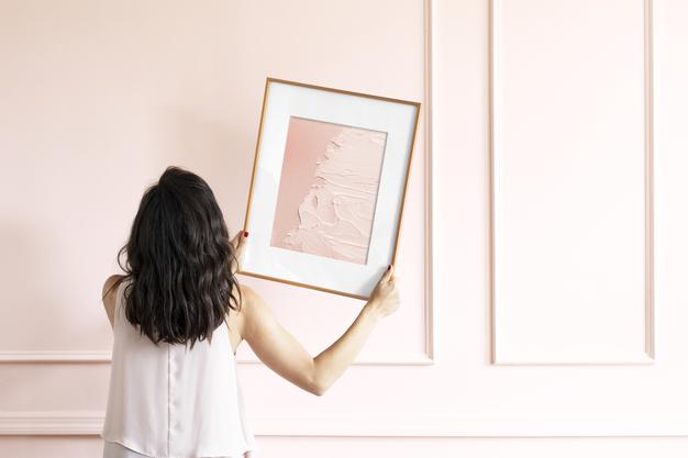 Free Woman Holding Picture Frame Mockup Psd