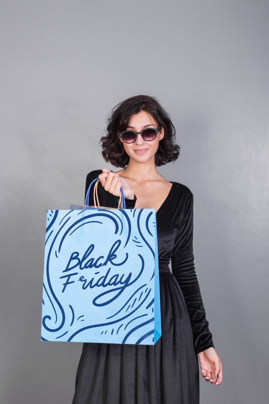 Free Woman Holding Shopping Bag Mockup With Black Friday Concept Psd