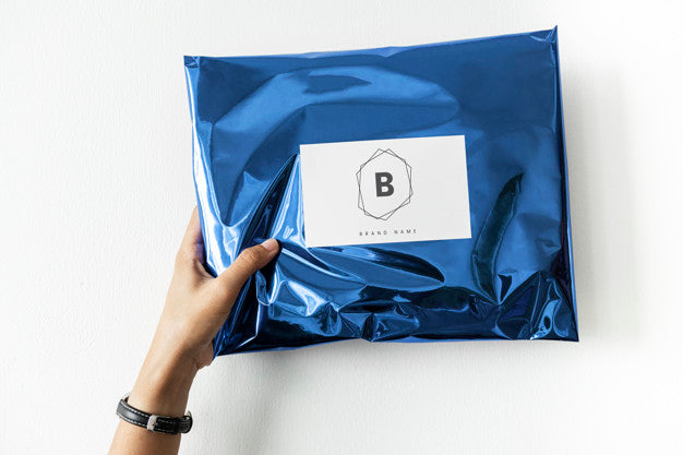 Free Woman Holding Up A Package Mockup Psd