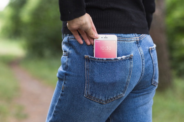 Free Woman In Nature With Smartphone In Pocket Psd