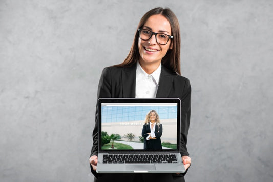 Free Woman Presenting Laptop Mockup Psd