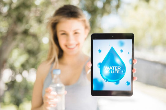 Free Woman Presenting Tablet Mockup With Water Concept Psd