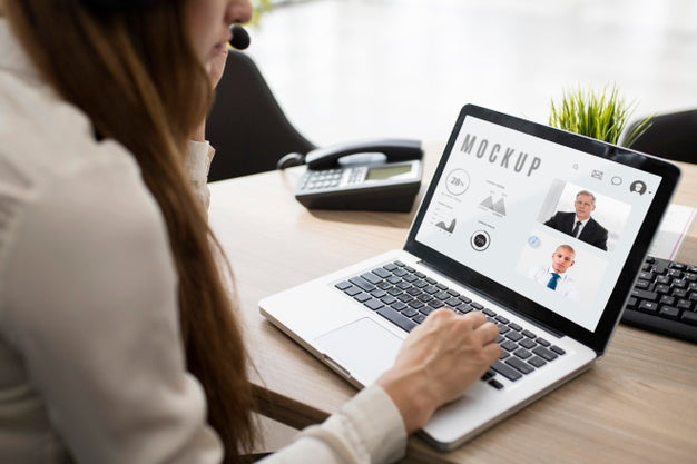 Free Woman Working On Her Laptop At Work Psd